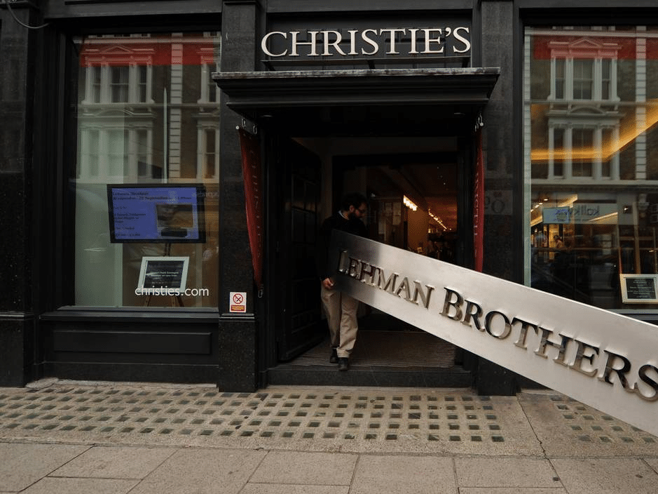 Lehman Brothers sign being carried to auction.